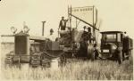 Cletrac 30A pulling John Deere combine